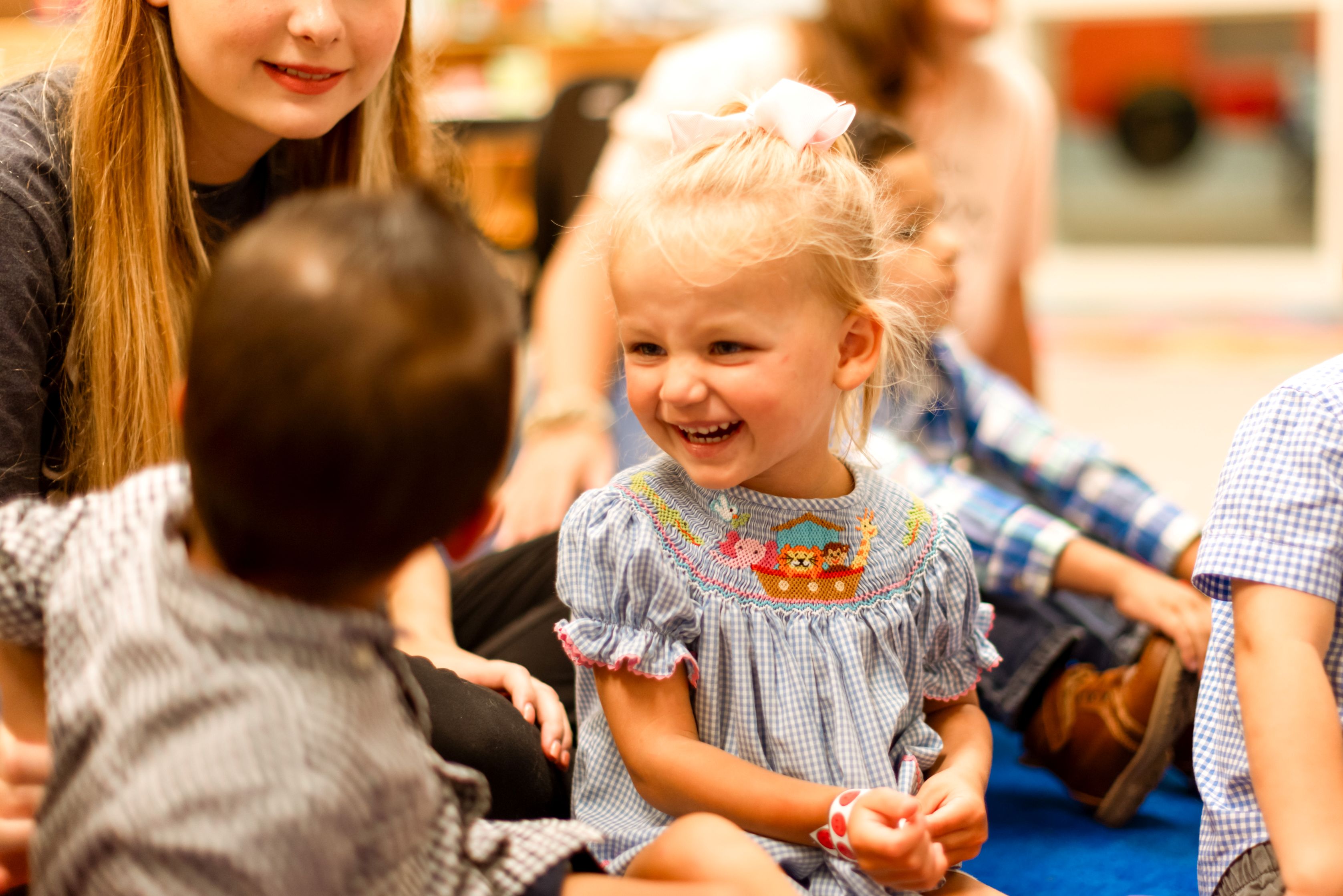 Little girl smiling at her friend